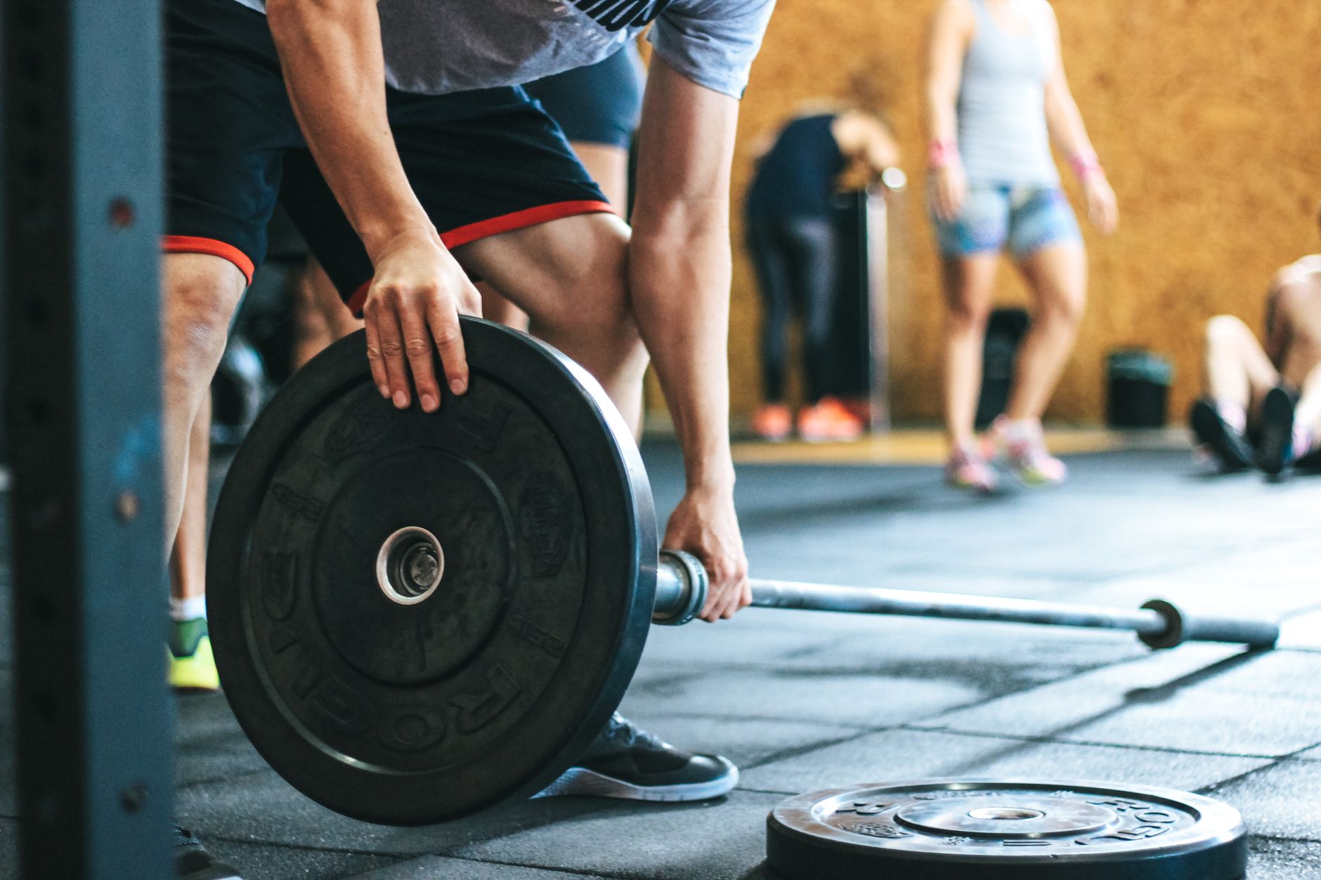 Coach leading a barbell strength class